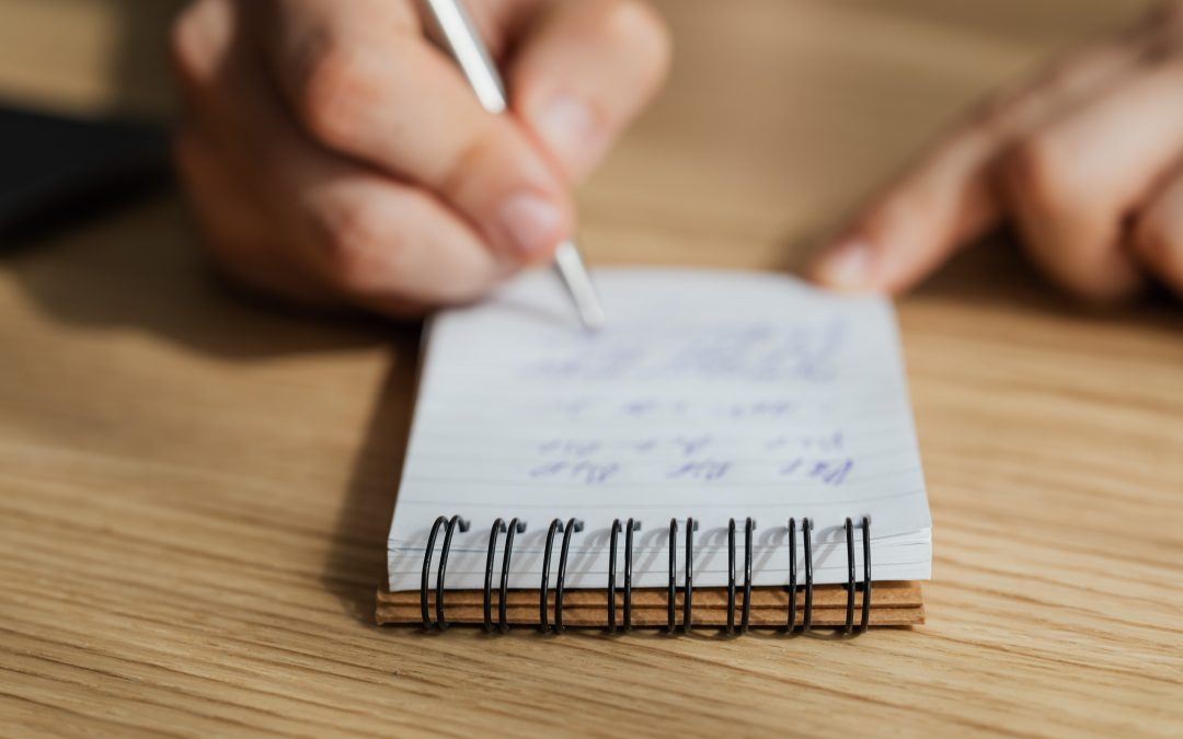 police man writes on notepad